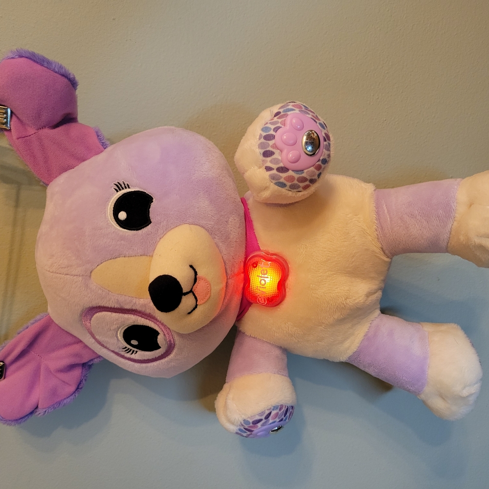 Interactive Purple and Cream Plush Toy